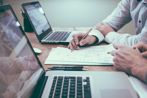 working on laptops Photo by Scott Graham on Unsplash